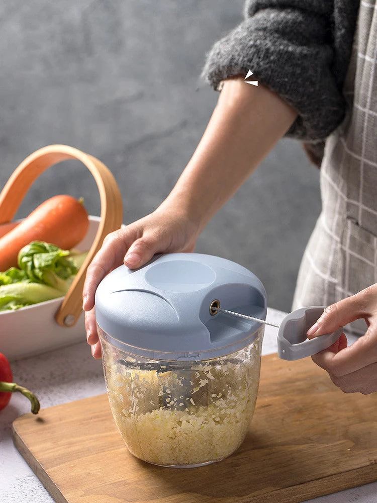 Garlic Crusher in use for efficient garlic mincing and food prep with a manual chopper.
