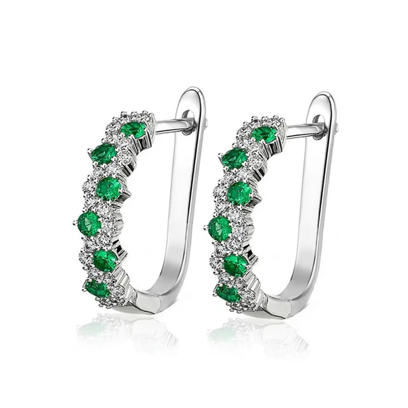Elegant green hoop earrings showcasing sparkling gemstones, perfect for special occasions or as fashionable accessories.