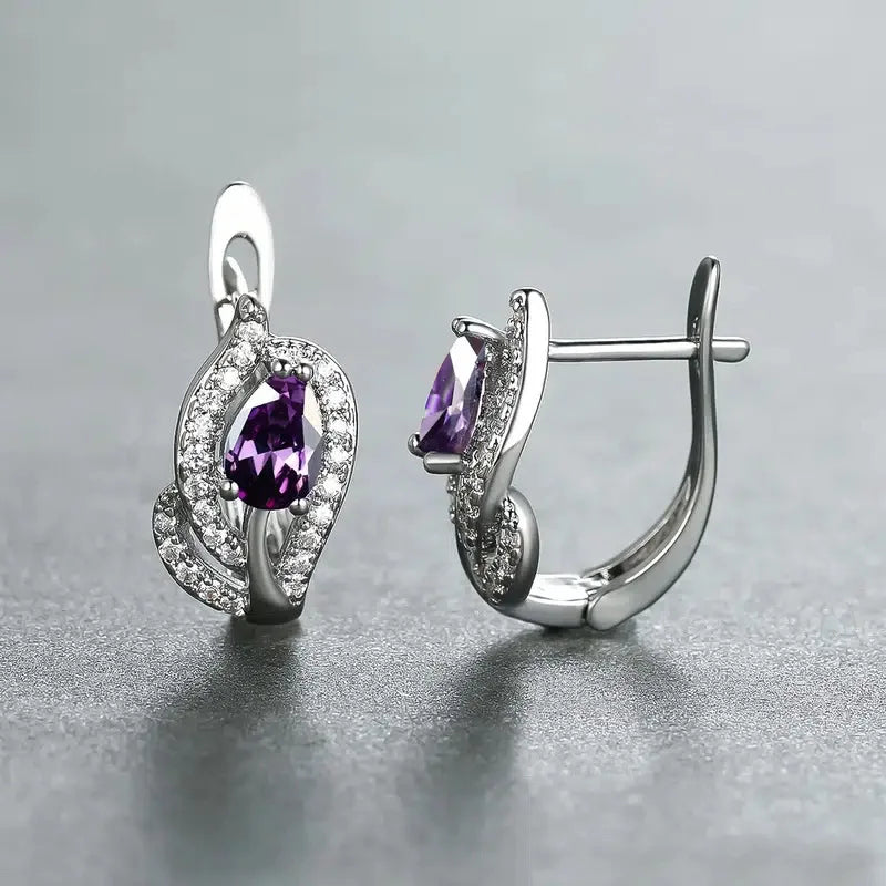 Elegant purple cubic zirconia hoop earrings showcasing a unique design with sparkly accents, perfect for parties and gifts.